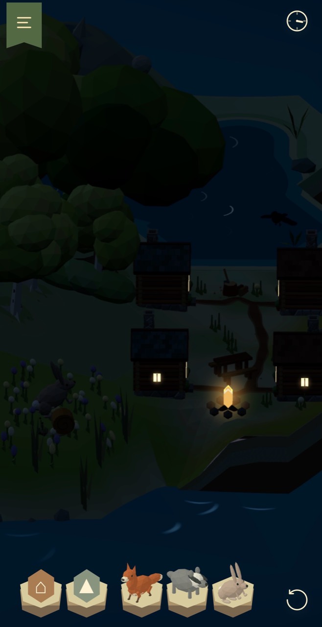 Warm cottage windows and a glowing campfire beside the water at night